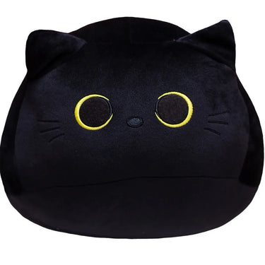 The KittyNook Cat Co. Velvet Plush Friend is a black cat pillow with yellow eyes, small nose, and pointed ears.